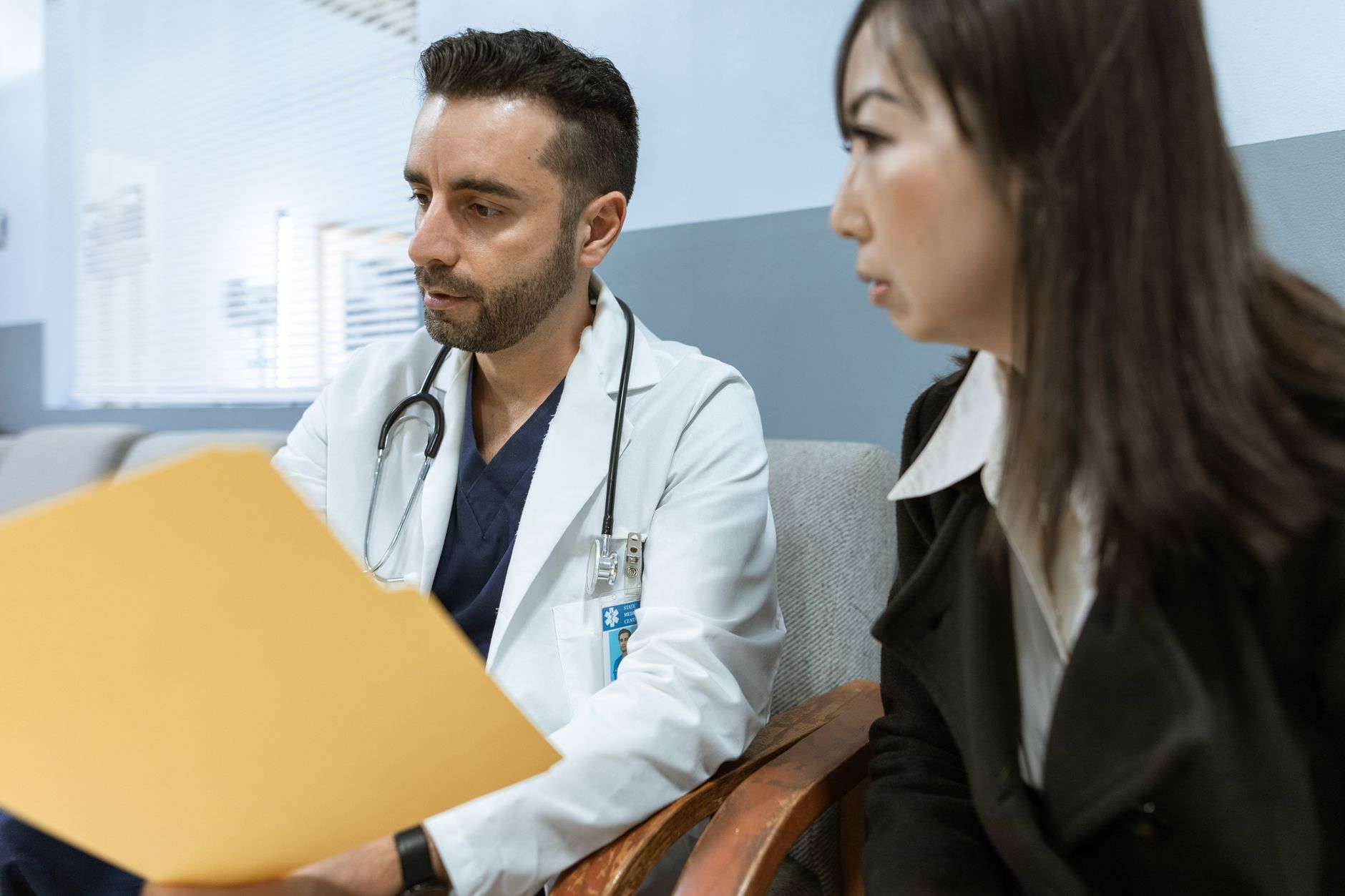 Nurse practitioner reviewing health records with a patient at a Jacksonville, FL clinic